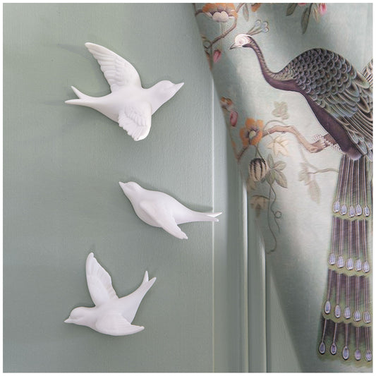 Juego de tres golondrinas de porcelana